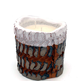 Handcrafted ceramic pot candle in platinum and shiny white glaze, front view showcasing textured embroidery-inspired surface.