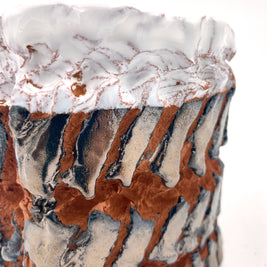 Close-up of the Ceramic Pot Candle’s textured side surface, highlighting intricate embroidery-inspired patterns enhanced by platinum glaze.