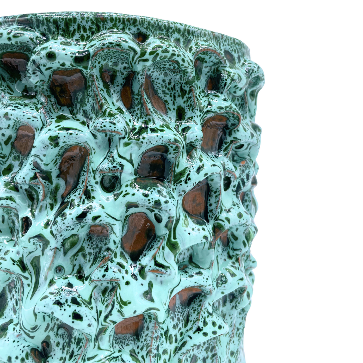 Side view detail of the Ceramic Vase in Aqua and Aventurine Green, highlighting the unique hand-formed wave texture and the rich color gradient of the Onda Series.