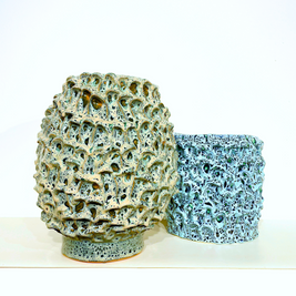 Two Ceramic Vases in Aqua and Saltwater Blue displayed together on a white background, showcasing the complementary colors and textures within the Onda Series.