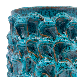 Close-up detail of the Ceramic Vase in Biscay Bay and Marine Blue, emphasizing its intricate, hand-formed wave texture and deep, rich colors and shades.