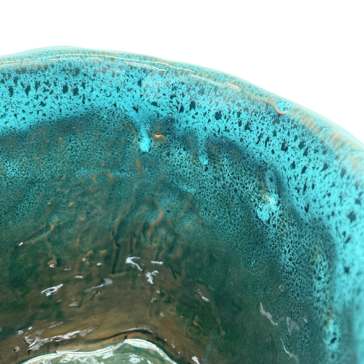 Side view from above of the Ceramic Vase in Biscay Bay and Marine Blue, showcasing the beautiful cerulean-blue highlights and distinctive wave-like texture.