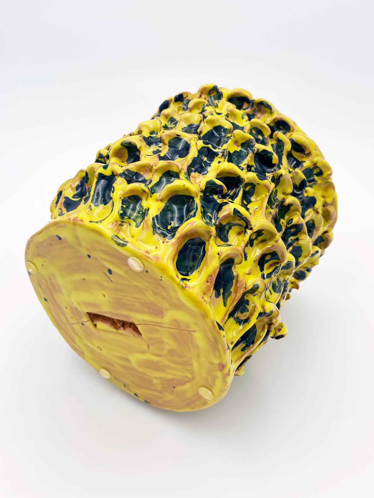 Bottom view of the Ceramic Vase in Cadmium Yellow and Izmir Blue, showcasing its handcrafted base and the distinct texture of the Onda Series.