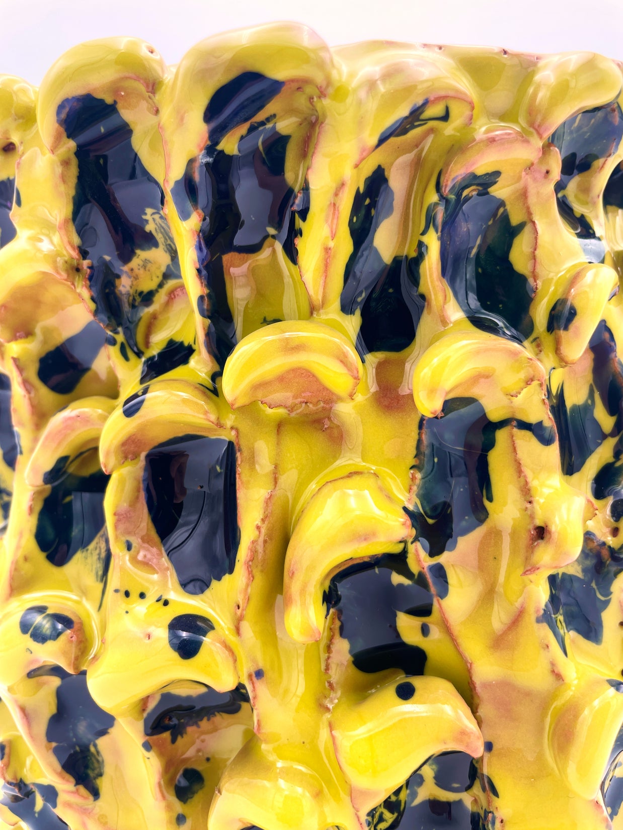 Close-up detail of the Ceramic Vase in Cadmium Yellow and Izmir Blue, emphasizing the texture, intricate wave patterns, and vibrant color blending.
