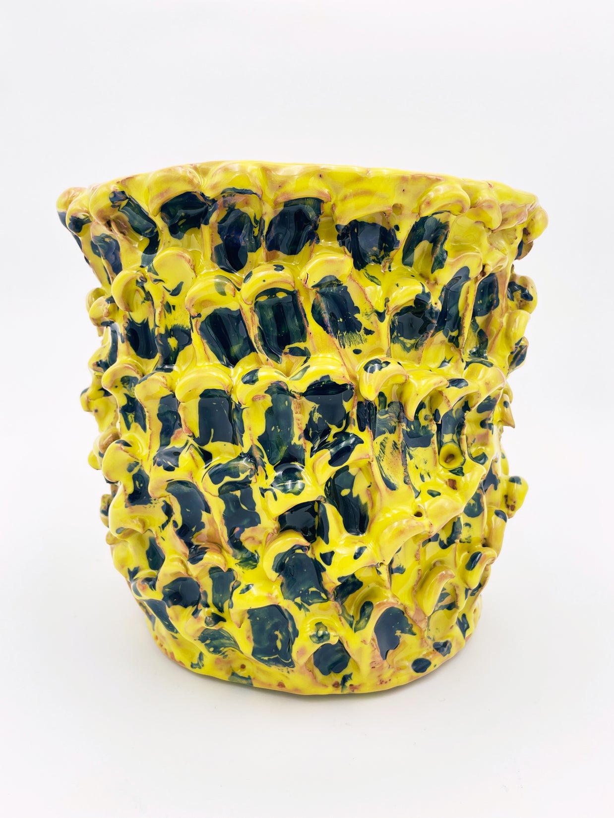 Front view of the Ceramic Vase in Cadmium Yellow and Izmir Blue, showcasing the organic wave texture and vibrant colors against a white background.