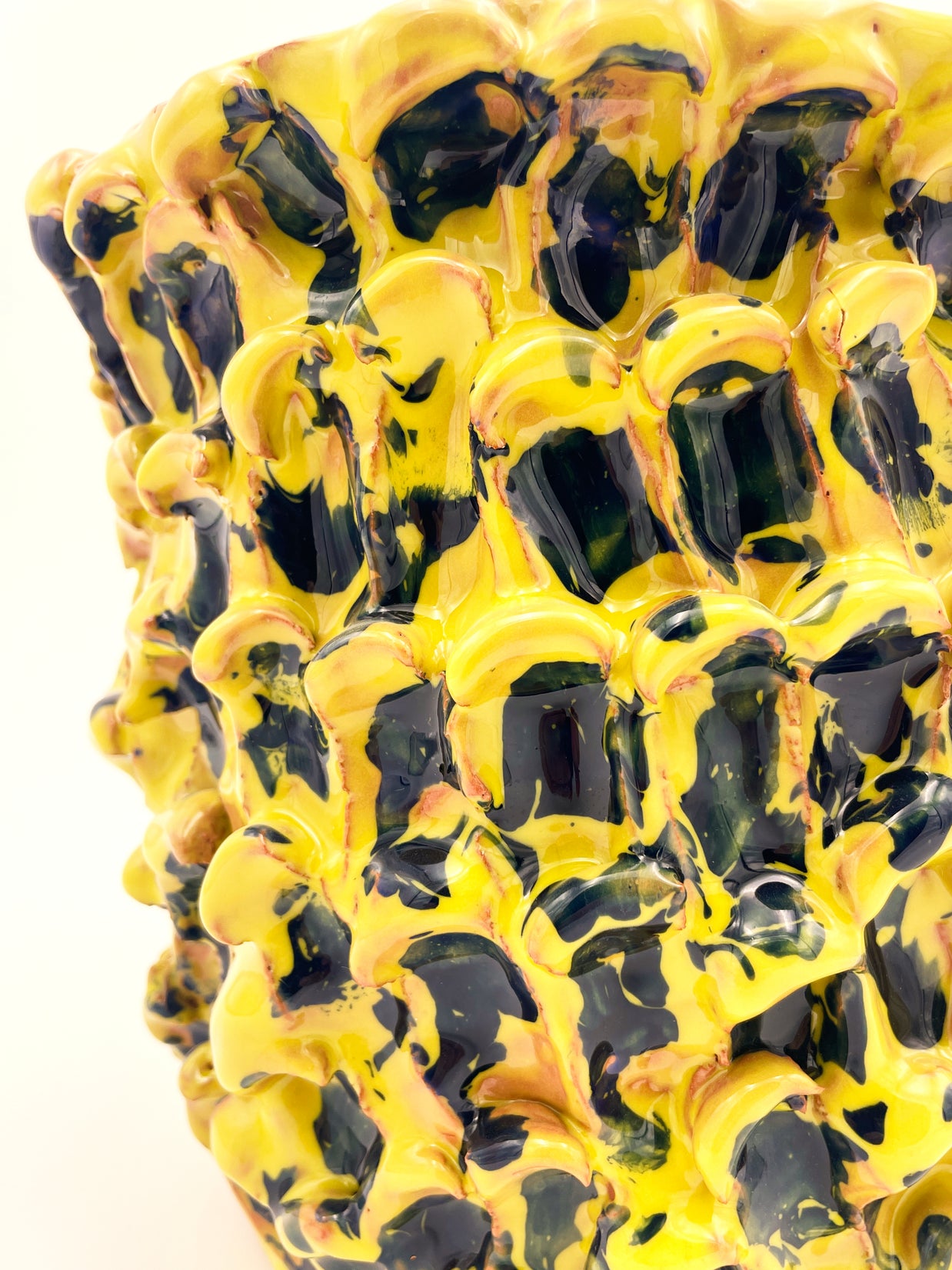 Close-up of the upper side of the Ceramic Vase in Cadmium Yellow and Izmir Blue, focusing on the fine wave details and rich color transition.