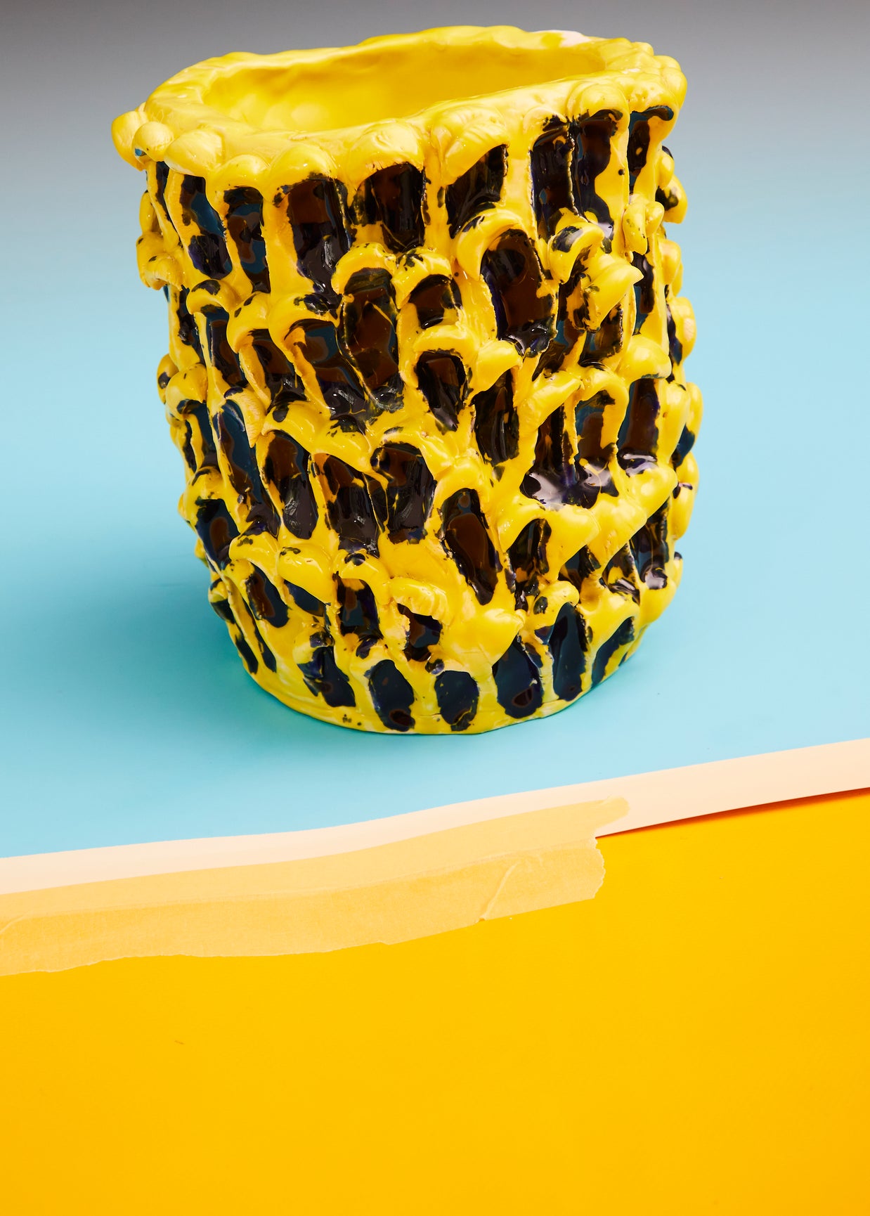 Ceramic Vase in Cadmium Yellow and Izmir Blue, captured in a shot that emphasizes the vivid, energetic colors and handcrafted wave texture.