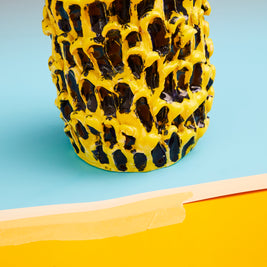 Ceramic Vase in Cadmium Yellow and Izmir Blue, captured in a shot that emphasizes the vivid, energetic colors and handcrafted wave texture.