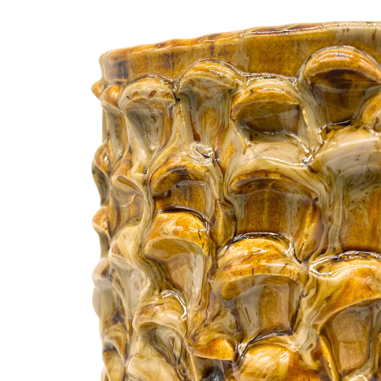 Close-up detail of the Ceramic Vase in Creme Caramel, emphasizing its intricate wave patterns and the artisanal quality of the glaze.