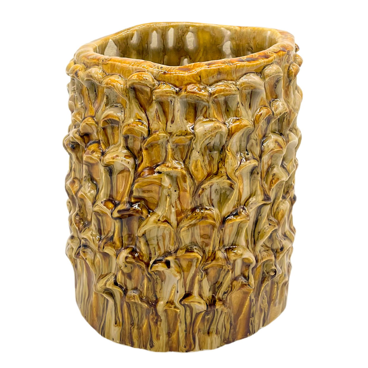 Overview of the Ceramic Vase in Creme Caramel on a white background, highlighting its hand-formed waves and warm caramel glaze.