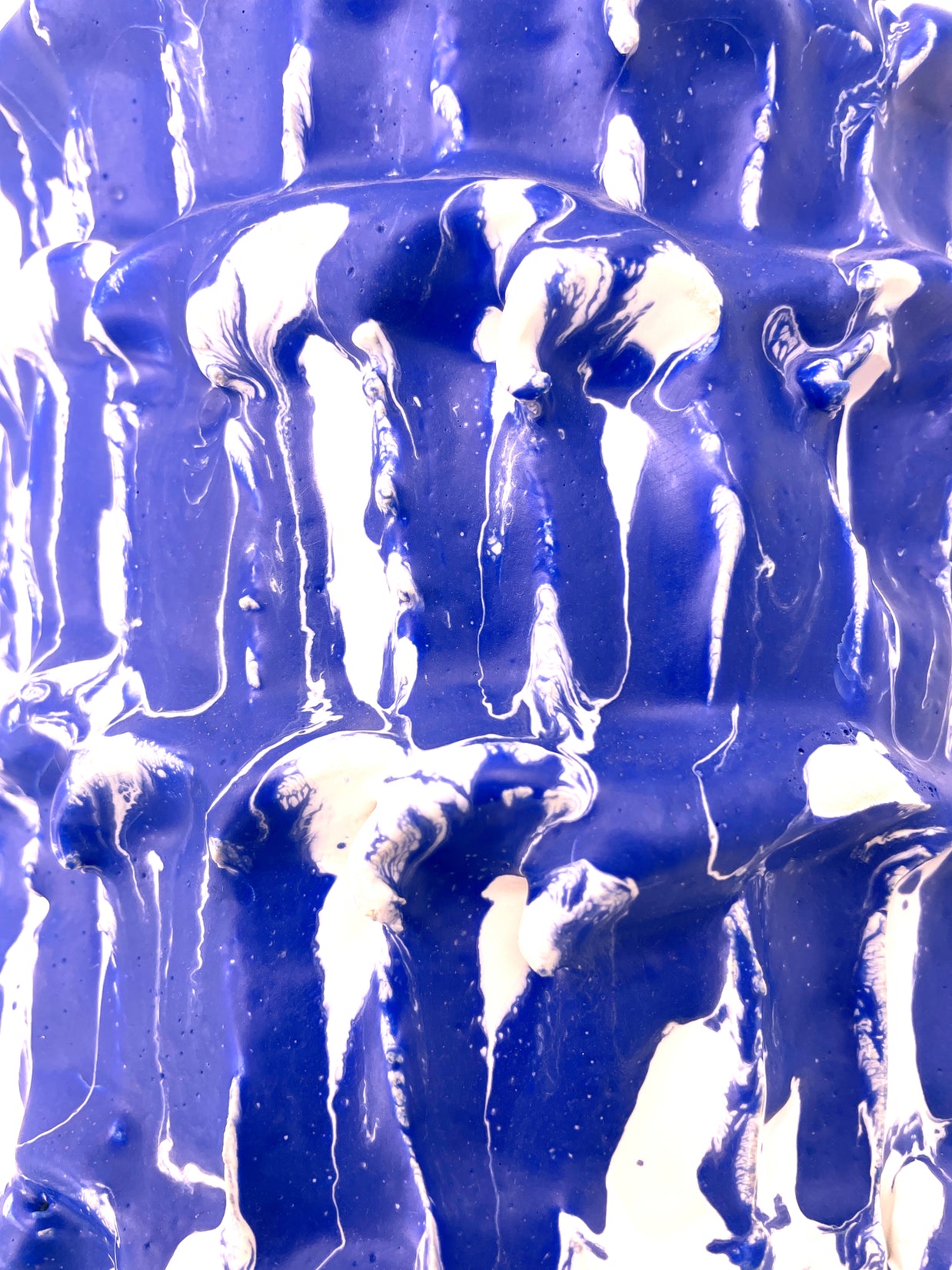 Close-up side detail of the Ceramic Vase in Egyptian Blue and White, focusing on the interplay of bold blue and soft white tones.