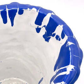 Upper side view of the Ceramic Vase in Egyptian Blue and White, showcasing the smooth interior and organic wave-inspired texture on a white background, with a soft white interior.