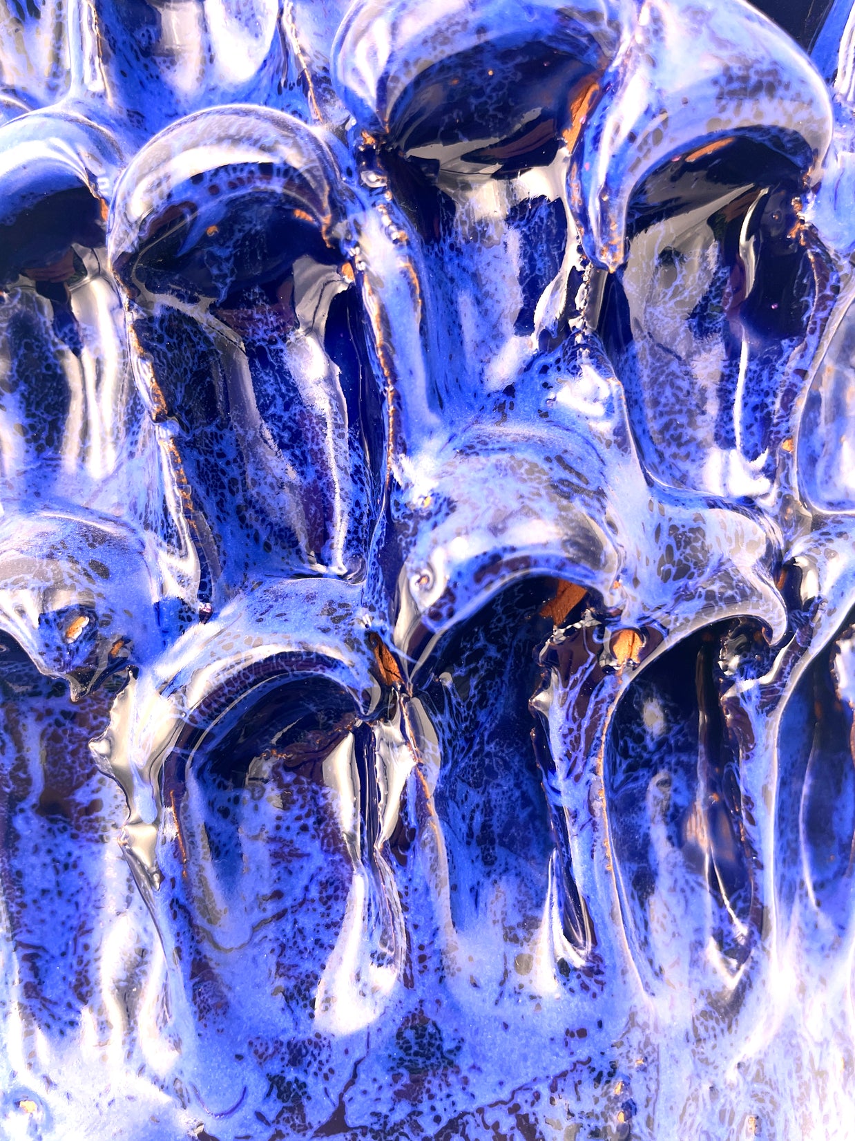 Extreme close-up detail of the Ceramic Vase in Egyptian and Izmir Blue, showcasing the micro-textures and glaze nuances with golden drops.