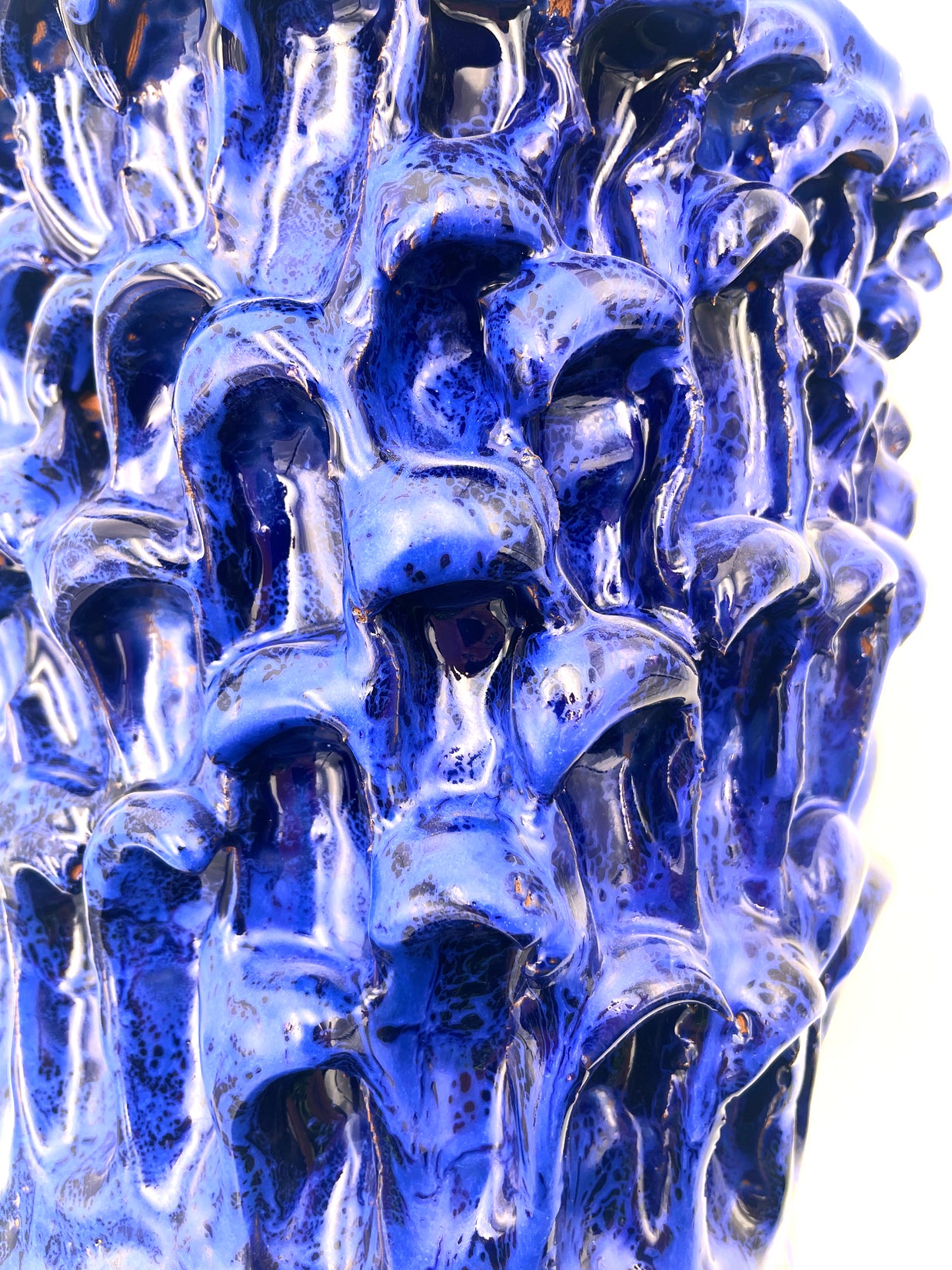 Detail view of the Ceramic Vase in Egyptian and Izmir Blue, highlighting the interplay of texture and color in the midsection of the vase.
