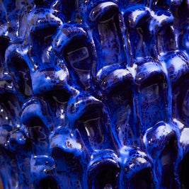 Wider and darker detail view of the Ceramic Vase in Egyptian and Izmir Blue, emphasizing the depth of texture and shadow play on the glaze.