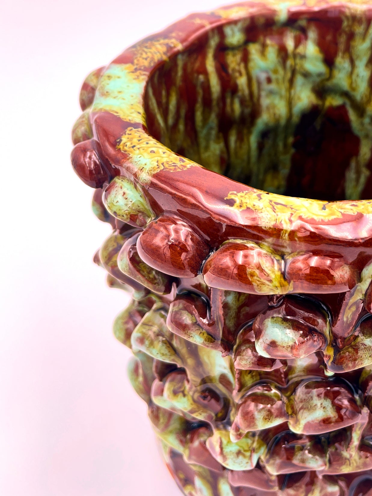 Upper side view of the Ceramic Vase in Honey and Turquoise, highlighting the smooth gradient of honey brown to turquoise blue glaze.