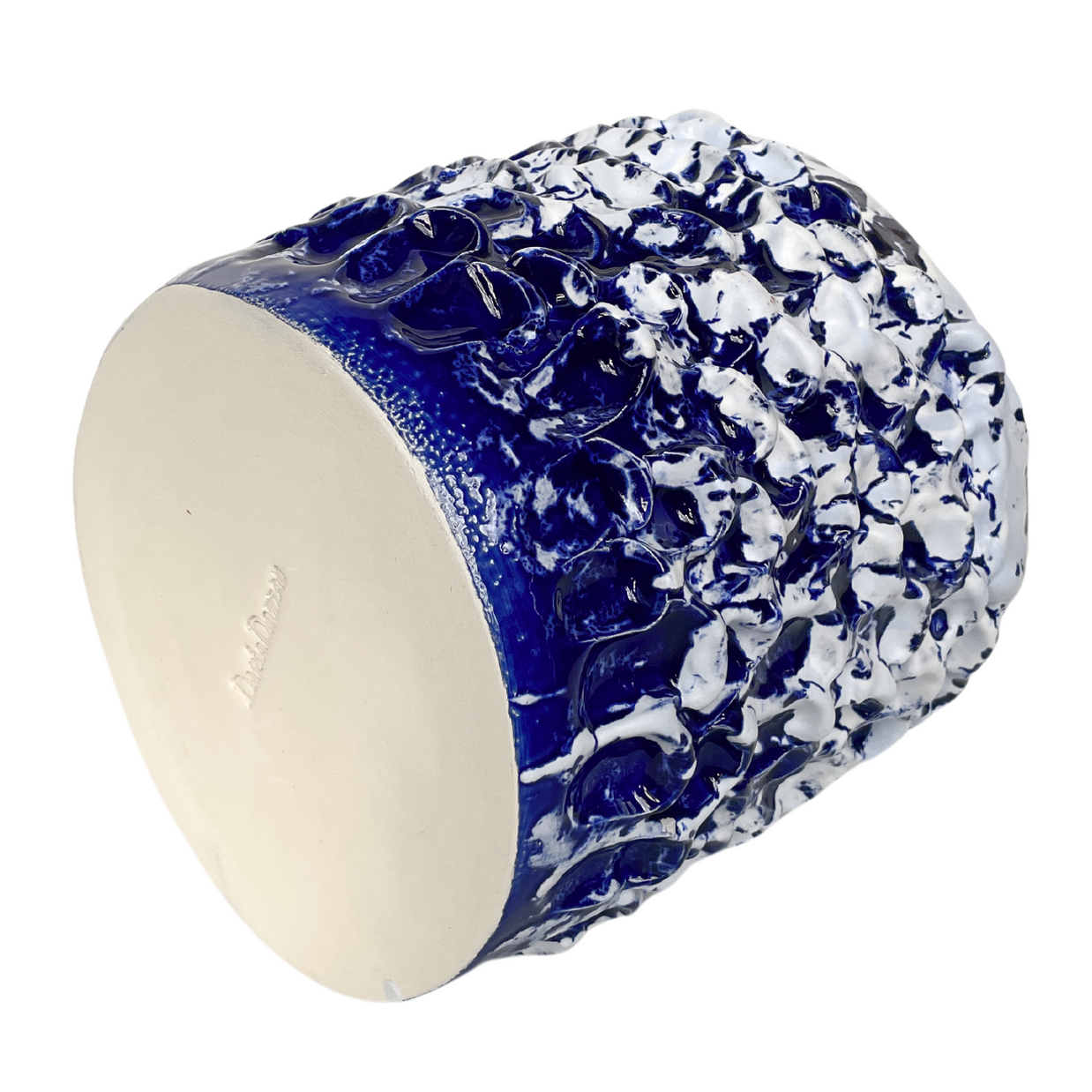 Side horizontal view of the Ceramic Vase in Izmir Blue and Matte White, showing the contrasting blue and white tones merging at the midsection.
