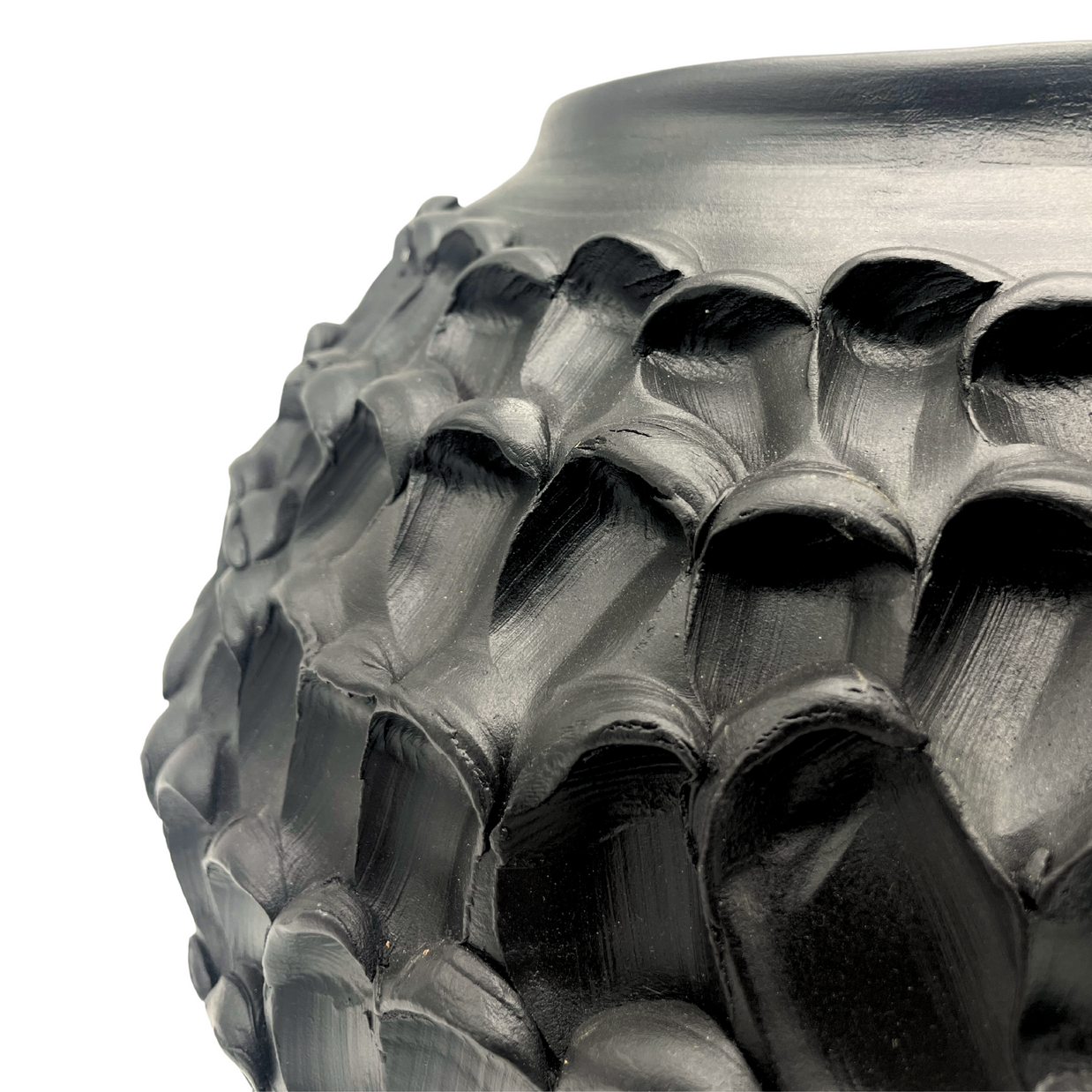 Close-up detail of the Ceramic Vase in Licorice Black, emphasizing its smooth texture and subtle curves with its muted black finish.