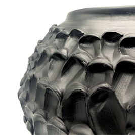 Close-up detail of the Ceramic Vase in Licorice Black, emphasizing its smooth texture and subtle curves with its muted black finish.