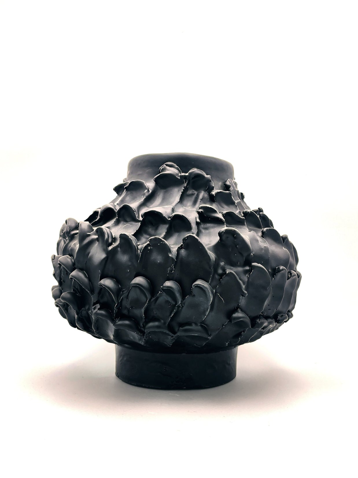 Front view of the Ceramic Vase in Licorice Black, with its sleek cylindrical base, widening center, and narrowing top, set against a clean white background.