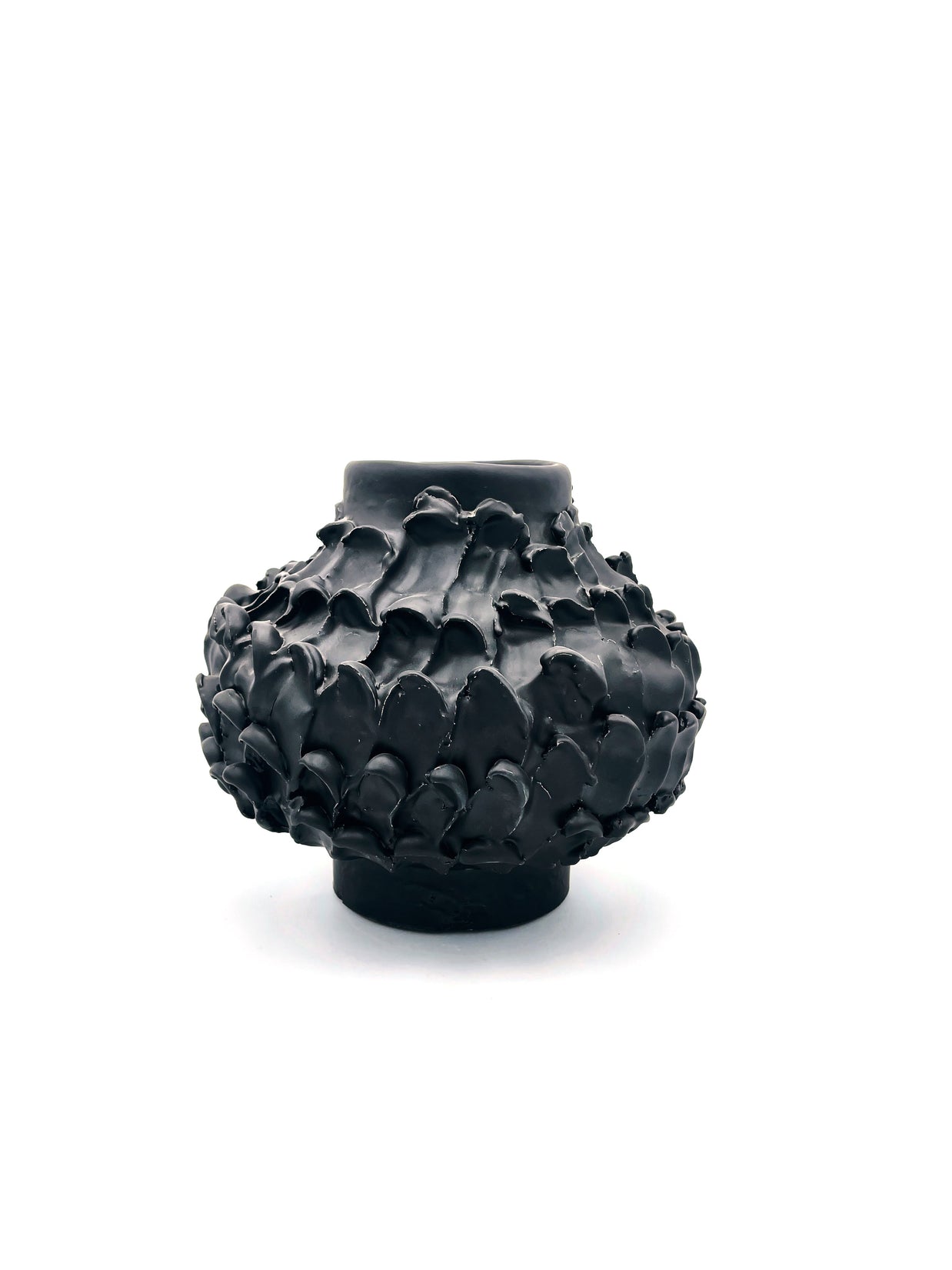 Wide-angle front view of the Ceramic Vase in Licorice Black, showcasing its unique shape with a cylindrical base, wider middle, and tapered top, all against a white background.