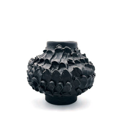Wide-angle front view of the Ceramic Vase in Licorice Black, showcasing its unique shape with a cylindrical base, wider middle, and tapered top, all against a white background.