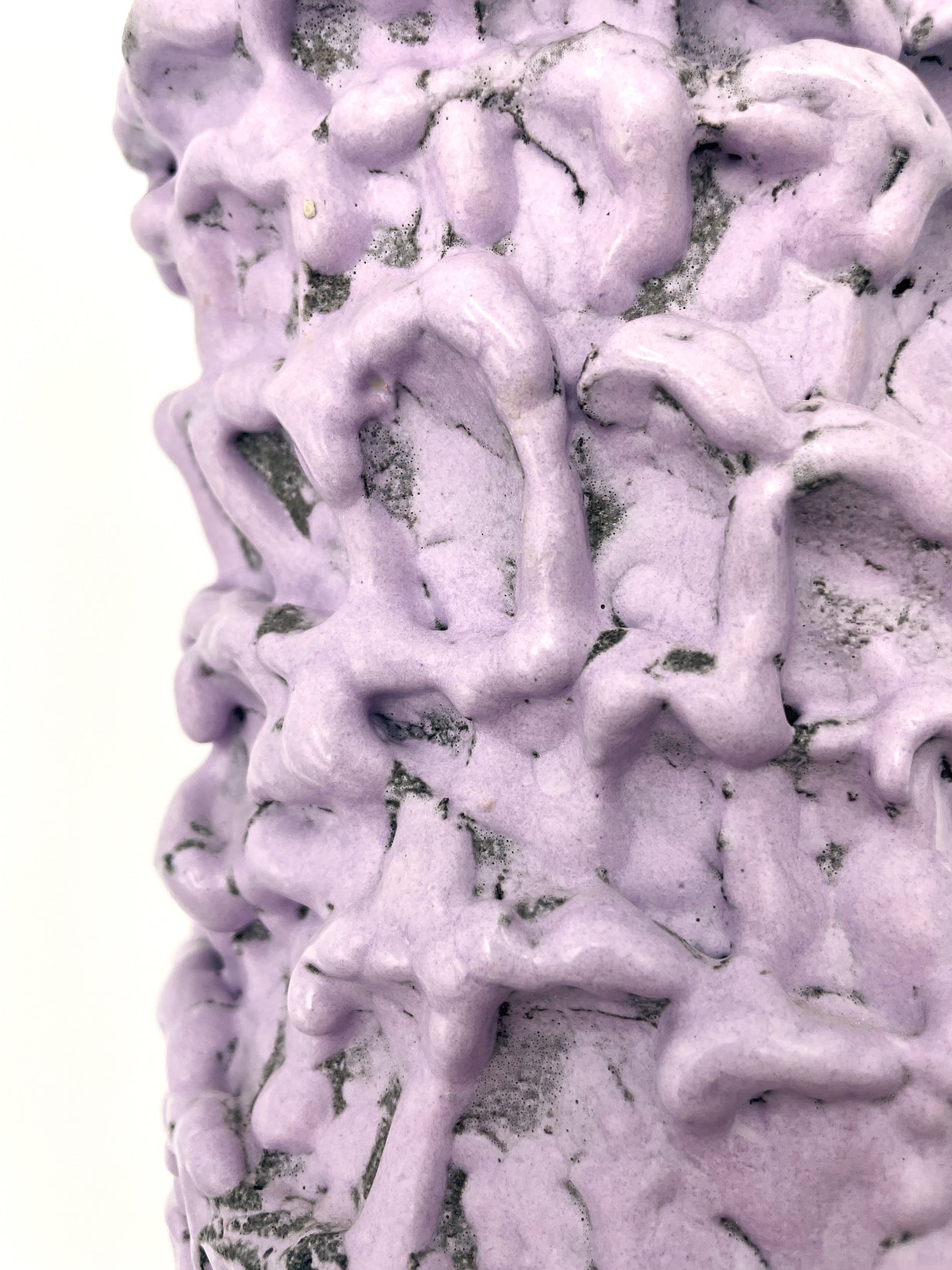 Close-up of the Ceramic Vase in Lilac Bubble & Chocolate, focusing on the interplay between the pastel pink base and the black accents.