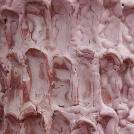 Close-up of the Ceramic Vase in Lilac Bubble & Matte Mauve, with its pink and peachy tones contrasted against a dramatic black background.