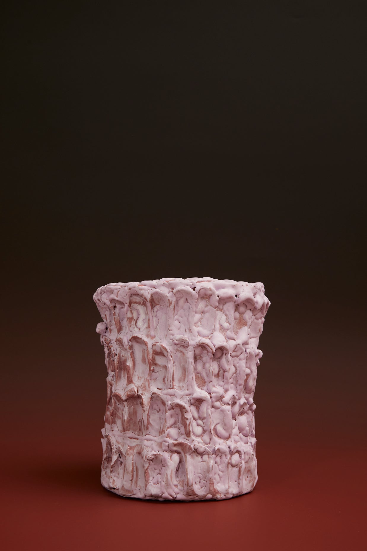 Front view of the Ceramic Vase in Lilac Bubble & Matte Mauve, styled with a black and terracotta-toned background, highlighting its soft pastel palette and artisanal details.