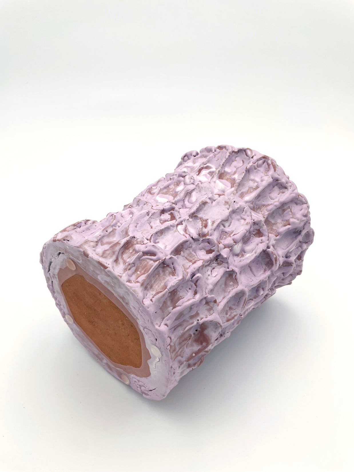 Horizontal zoomed-out view of the Ceramic Vase in Lilac Bubble & Matte Mauve, highlighting its elegant shape and subtle transitions between pink and peach tones.