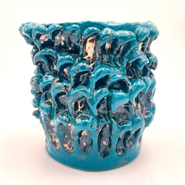 Front view of the Ceramic Vase in Metallic Biscay Bay from another angle, capturing its luminous metallic sheen and soft cloud-like texture.