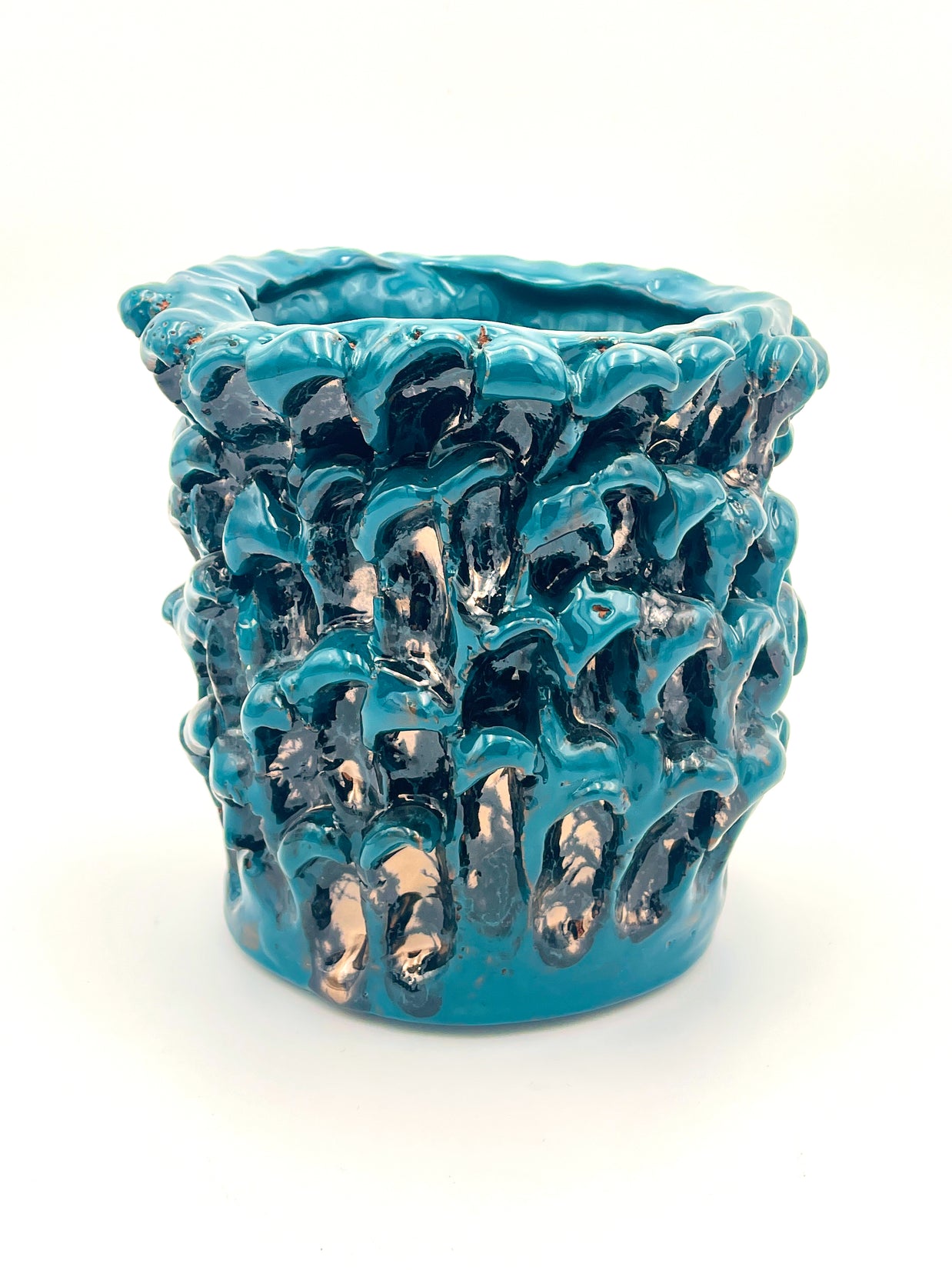 Front view from a slightly different angle of the Ceramic Vase in Metallic Biscay Bay, emphasizing the dynamic interplay of its petrol blue, black, and golden hues.