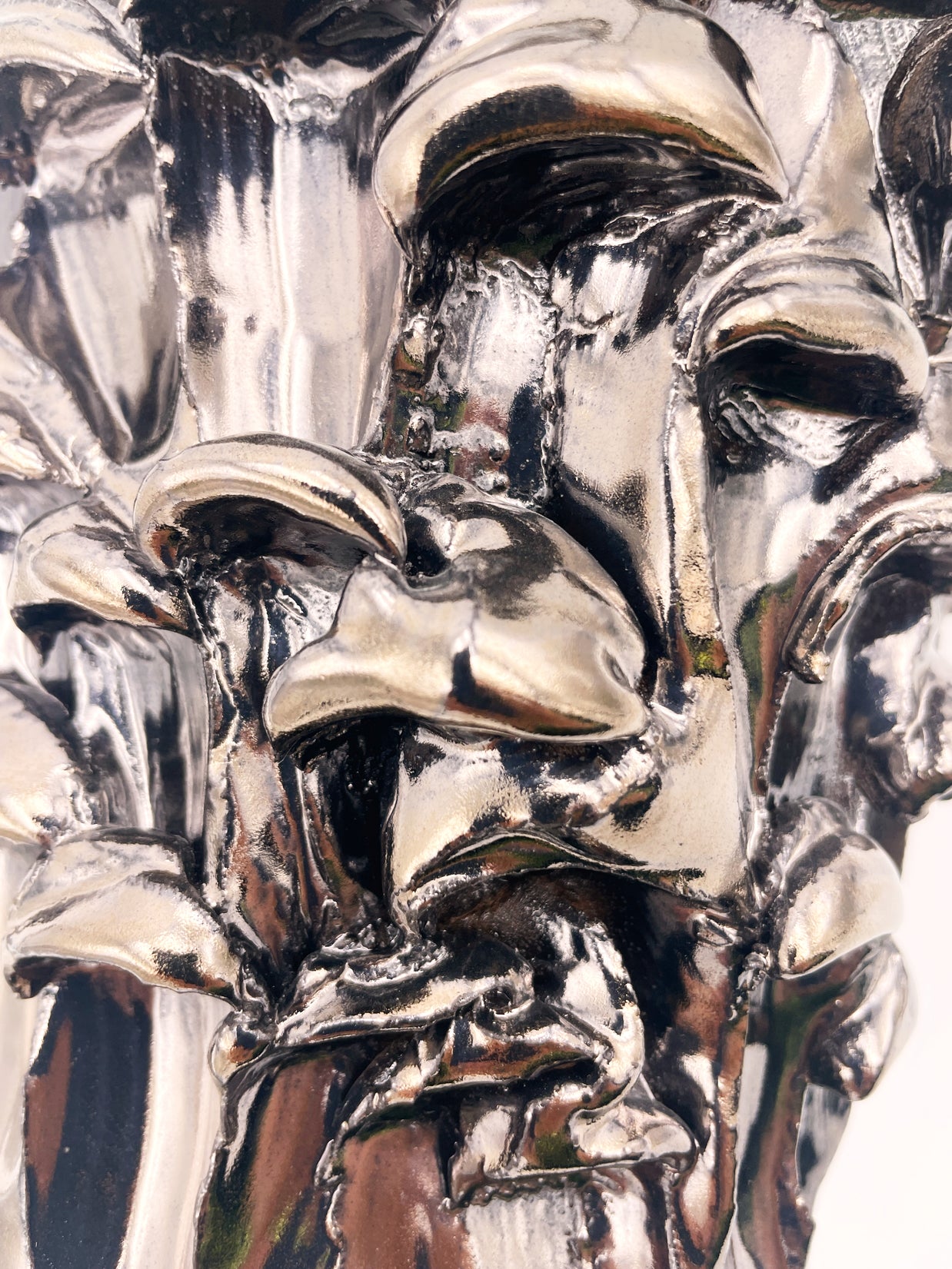 Close-up detail of the Ceramic Vase in Metallic Platinum, showcasing the intricate metallic texture with subtle reflective highlights.