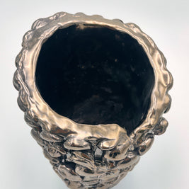 Top view of the Ceramic Vase in Metallic Platinum, emphasizing the silvery reflection on its surface with shifting light angles.