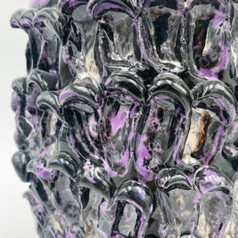 Close-up of the Ceramic Vase in Metallic Purple, focusing on its glossy finish and the subtle interplay of metallic colors.