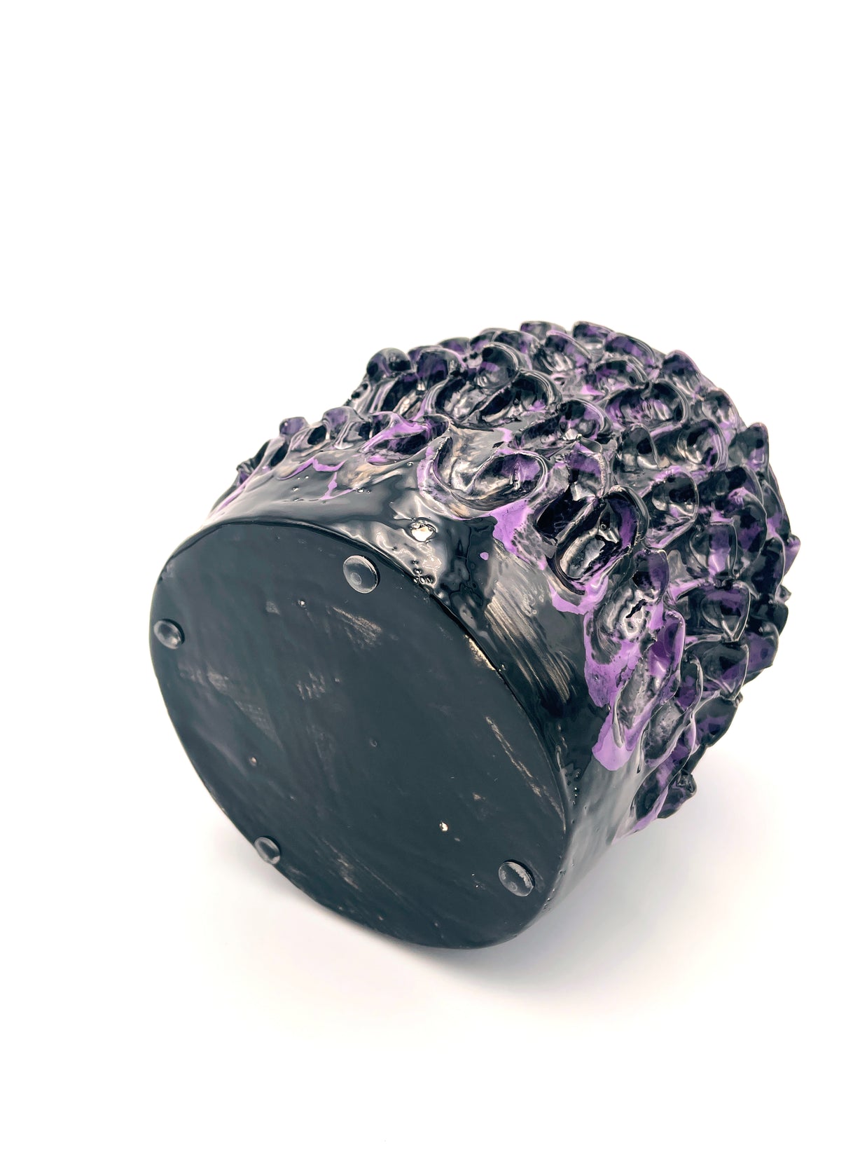 Horizontal view of the Ceramic Vase in Metallic Purple, emphasizing its sleek shape and reflective metallic hues.
