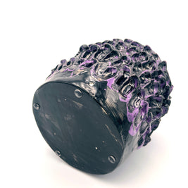 Horizontal view of the Ceramic Vase in Metallic Purple, emphasizing its sleek shape and reflective metallic hues.