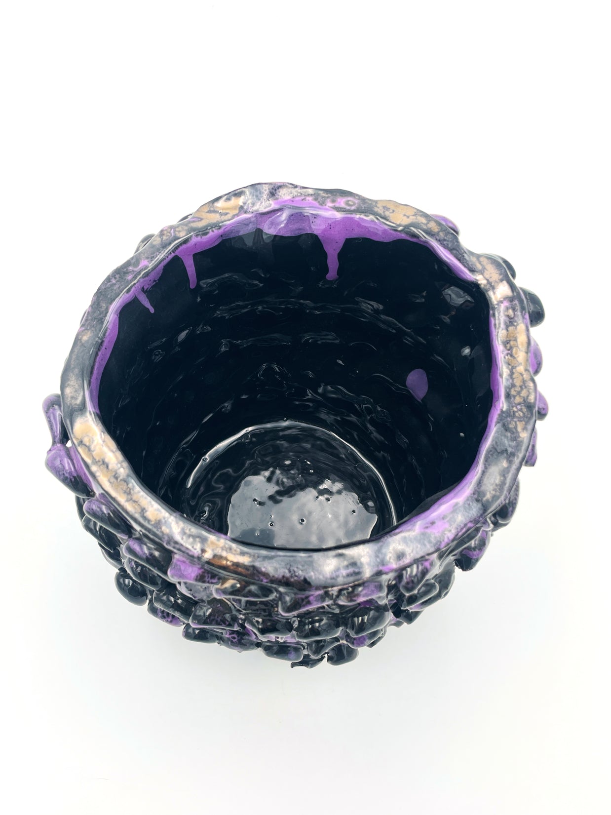 Top view of the Ceramic Vase in Metallic Purple, revealing its dark interior and shimmering, blended color effects near the rim.