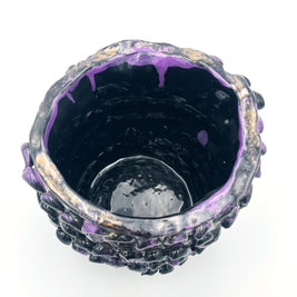 Top view of the Ceramic Vase in Metallic Purple, revealing its dark interior and shimmering, blended color effects near the rim.