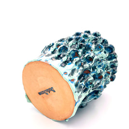 Bottom view of the Ceramic Vase in Metallic Tiffany and Turquoise, showing the artist's signature and the smooth uniform texture of the base.