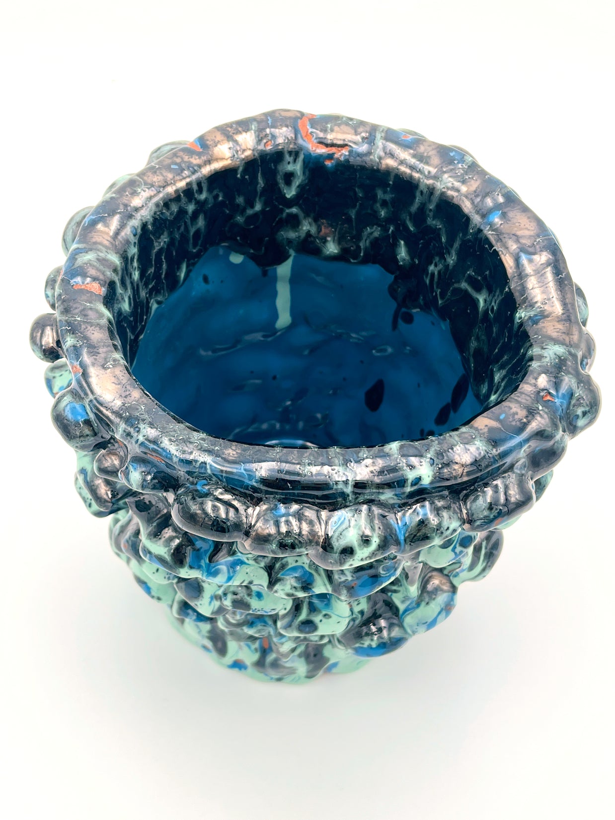 Top view of the Ceramic Vase in Metallic Tiffany and Turquoise, revealing its smooth, slightly shimmering glaze and detailed transitions in color.