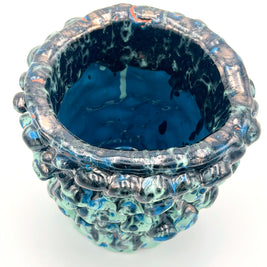 Top view of the Ceramic Vase in Metallic Tiffany and Turquoise, revealing its smooth, slightly shimmering glaze and detailed transitions in color.