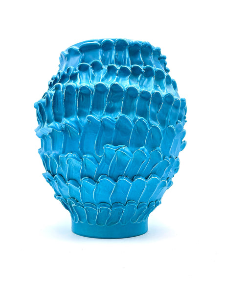 Front view of the Ceramic Vase in Ocean Matte Turquoise, showcasing its smooth, wave-like texture and soft matte finish over a white background.
