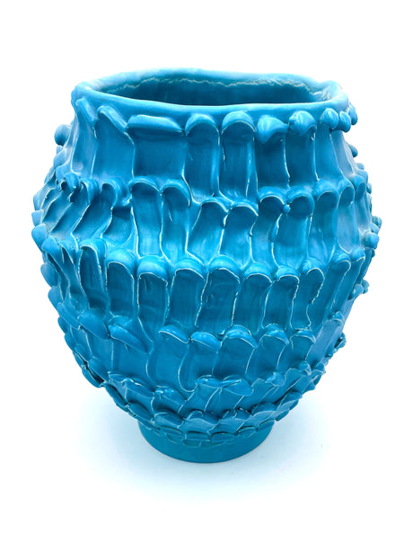 Different front view of the Ceramic Vase in Ocean Matte Turquoise, highlighting its hand-sculpted form and flawless glazing over a white backgroud.