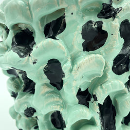 Close-up view of the texture on the Ceramic Vase in Tiffany and Pitch Black, highlighting the wave patterns and black inserts, with a clean white background.