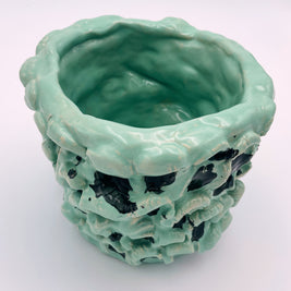 Top diagonal view of the Ceramic Vase in Tiffany and Pitch Black, capturing the texture and form of the vase from a dynamic perspective.