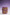Front view of the Ceramic Vase in Velvet Purple and Lemon Yellow, placed against a gradient background transitioning from deep violet at the top to white at the bottom.