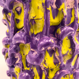 Close-up view of the Ceramic Vase in Velvet Purple and Lemon Yellow, focusing on the interplay of the soft matte purple finish and the dynamic yellow accents on the wavy texture.