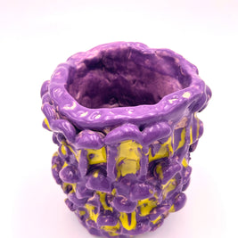 Front view of the Ceramic Vase in Velvet Purple and Lemon Yellow, displayed against a soft pink background for a warm and elegant look.