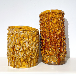 Composition of two Ceramic Vases in Creme Caramel in different sizes, displayed side by side to showcase their complementary design.